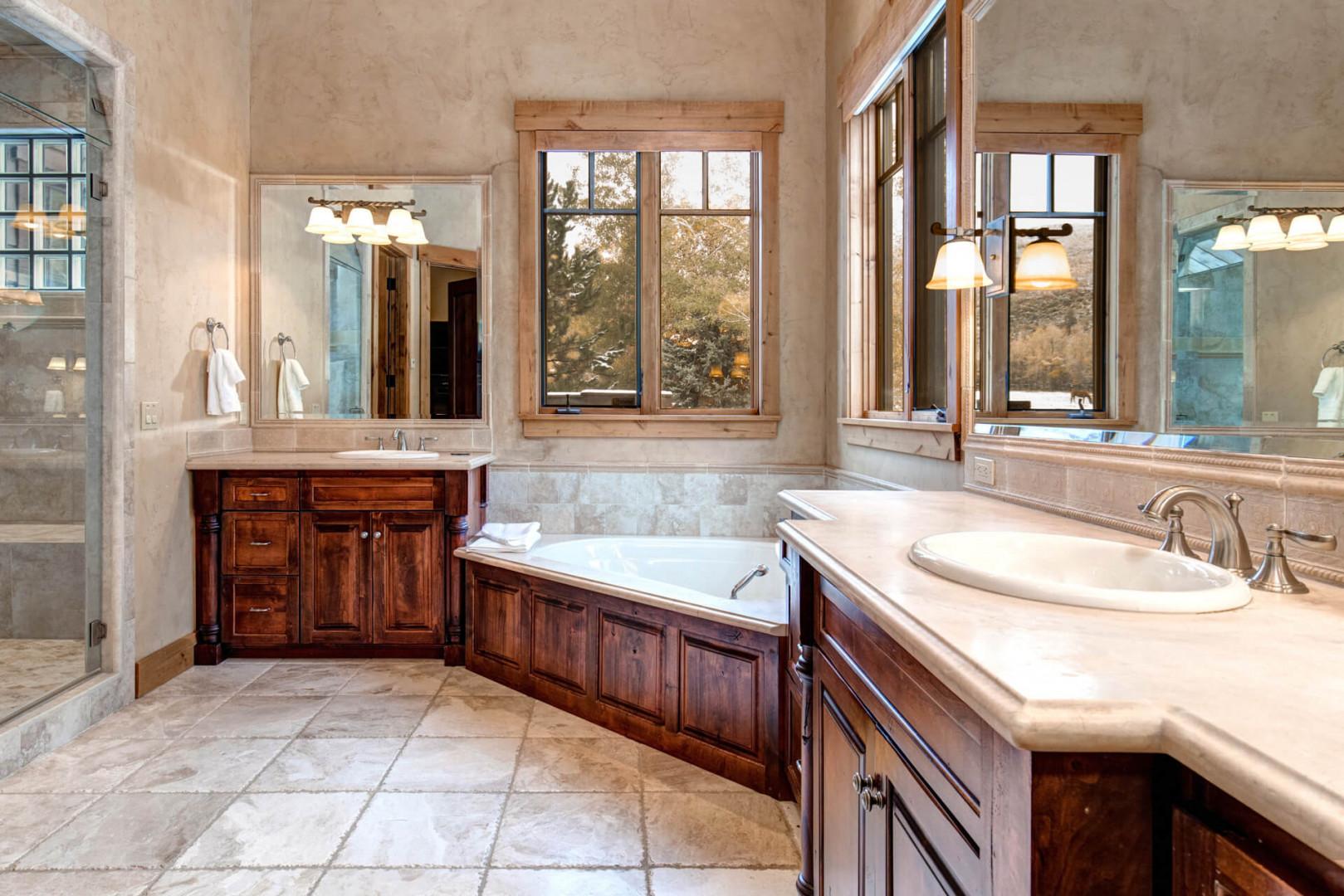 Bathroom: "Luxurious bathtub and elegant sinks create a spa-like retreat."