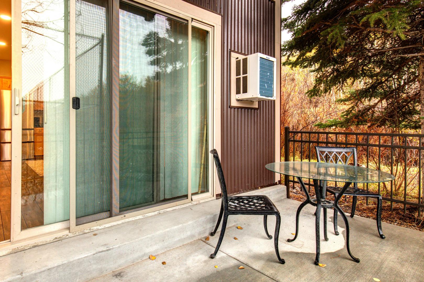 Inviting space with a table and chairs for relaxation and enjoyment.