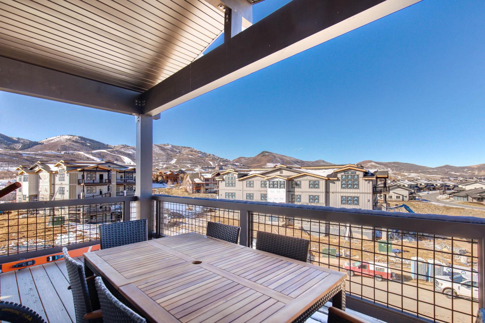 Outdoor Patio: "Inviting table and seats for al fresco dining and relaxation."