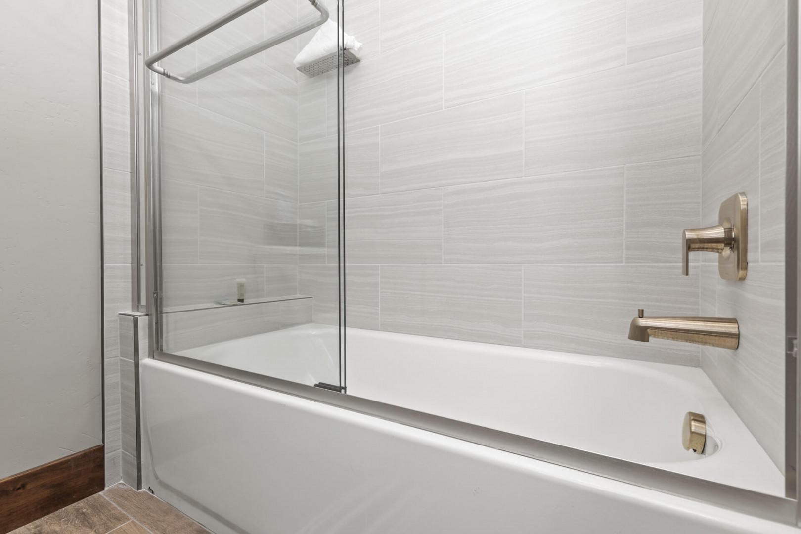 Relaxing soak awaits in this convenient tub shower combo.