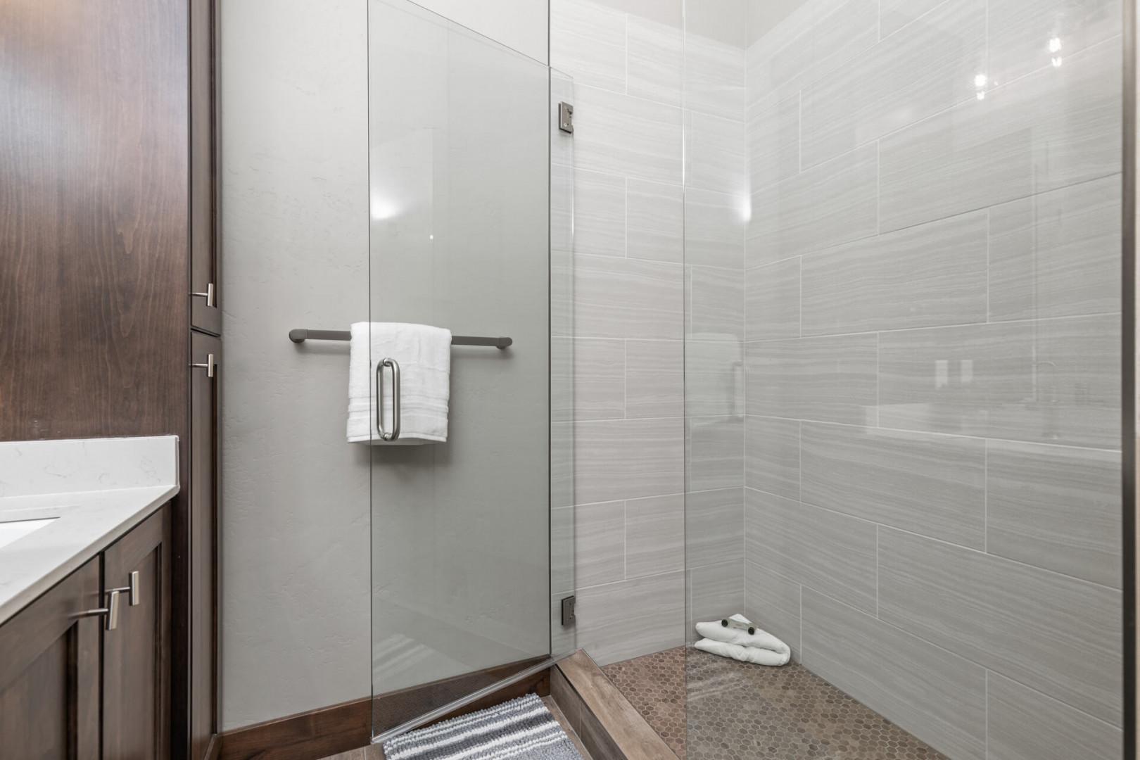 Modern shower with sleek glass enclosure, a perfect oasis for relaxation.