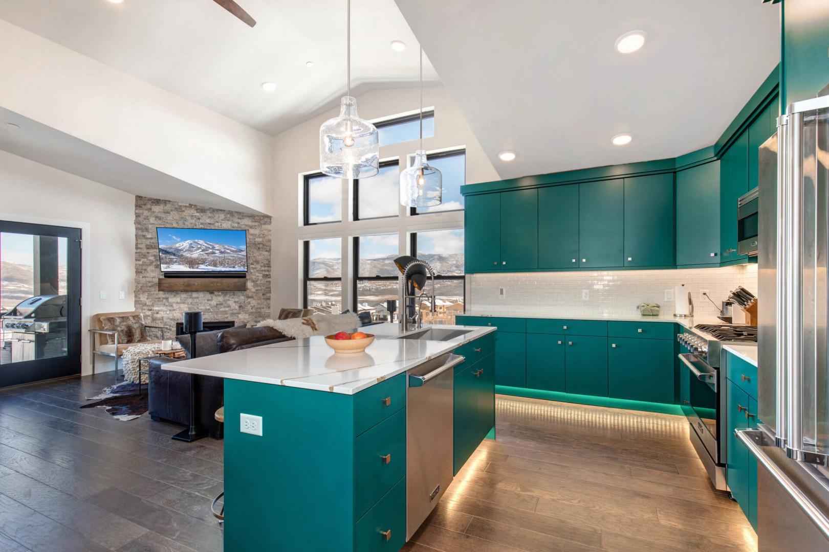 Sparkling clean kitchen sink in a spacious, well-lit cooking area.