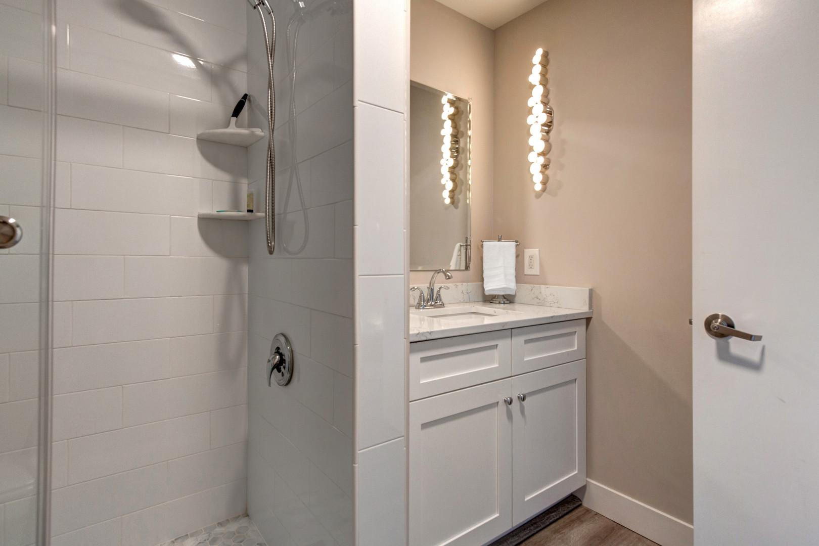 Stillwater 3067: Sleek sink and shower area with modern fixtures and clean design.