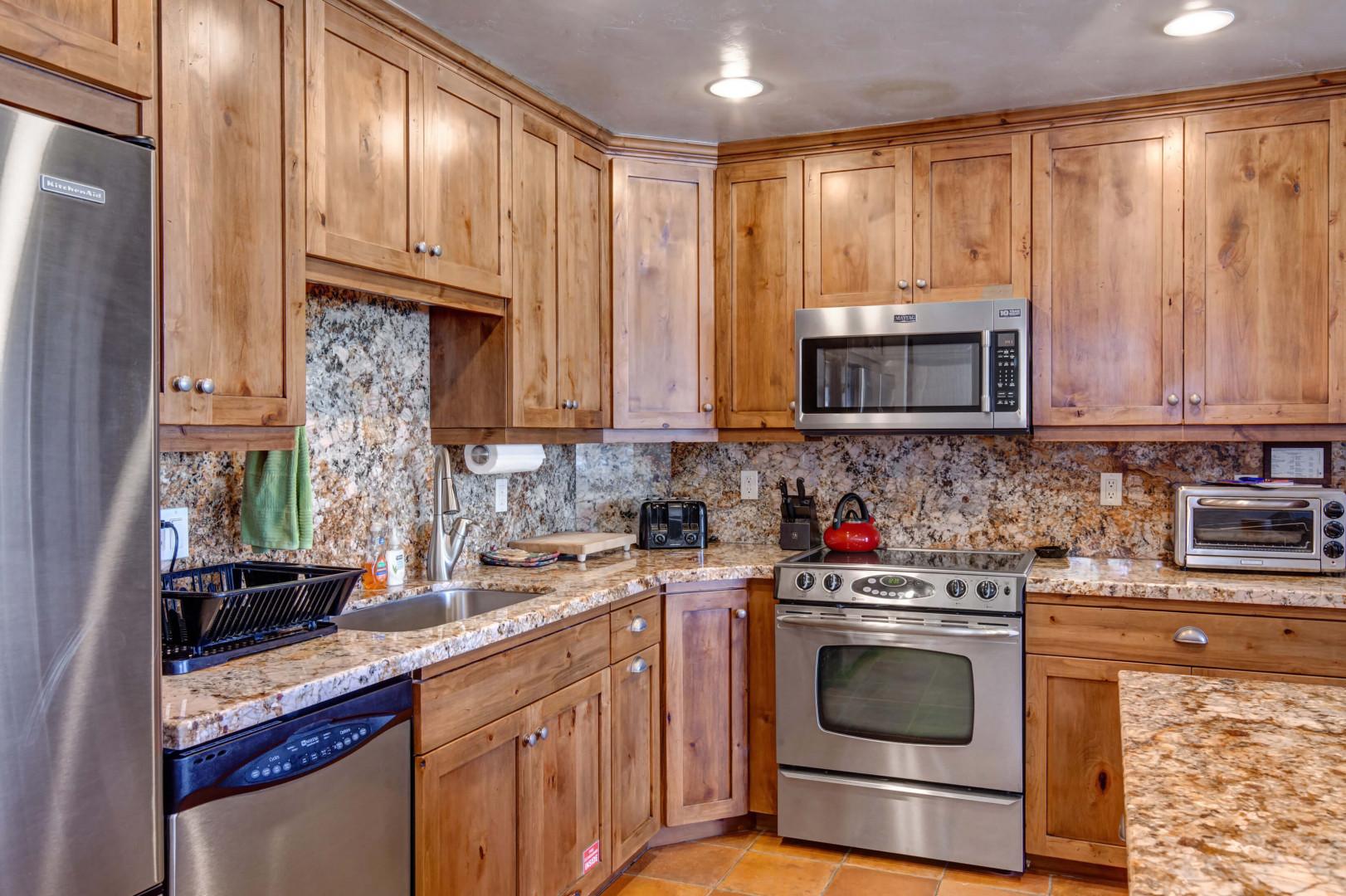 Wood cabinets, & kitchen tops - a cook's paradise.