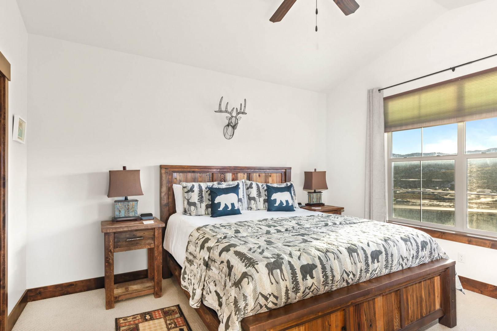 Drift off in your rustic bedroom with nature-themed bedding, warm wood furnishings, and serene landscape views right outside your window.