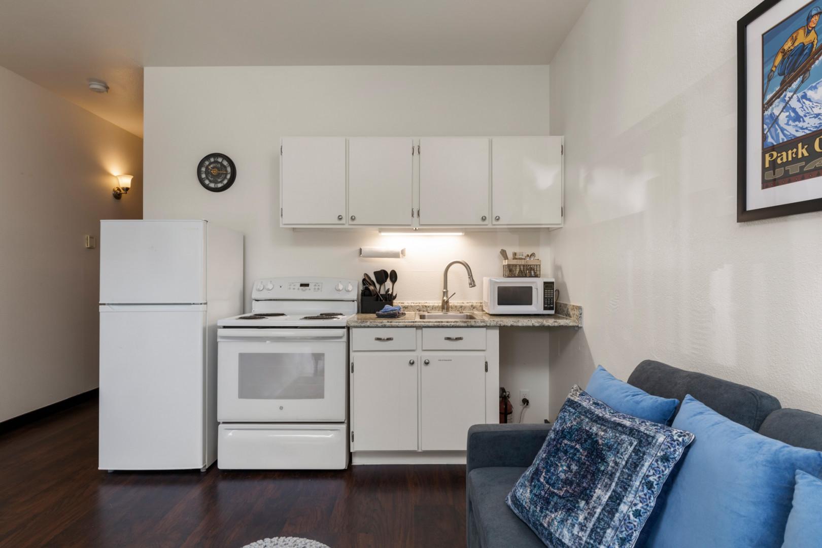 Modern appliances and ample storage in sleek kitchen design.