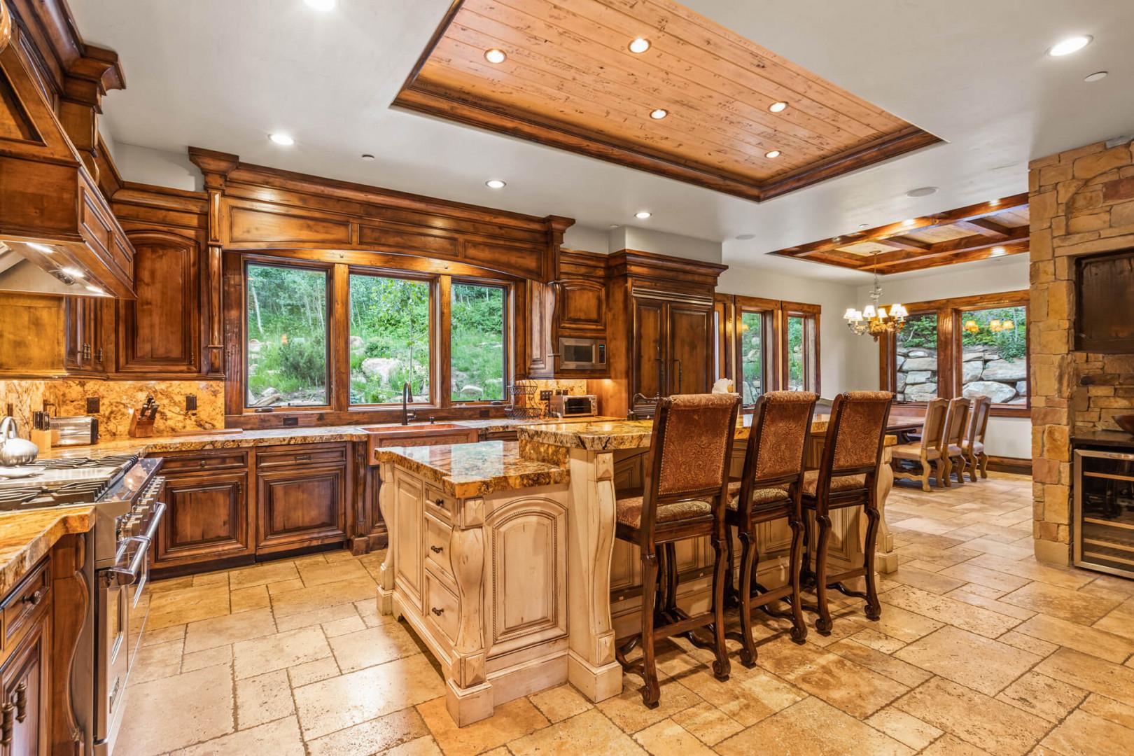 Cozy kitchen with bar table and dining area for family gatherings.