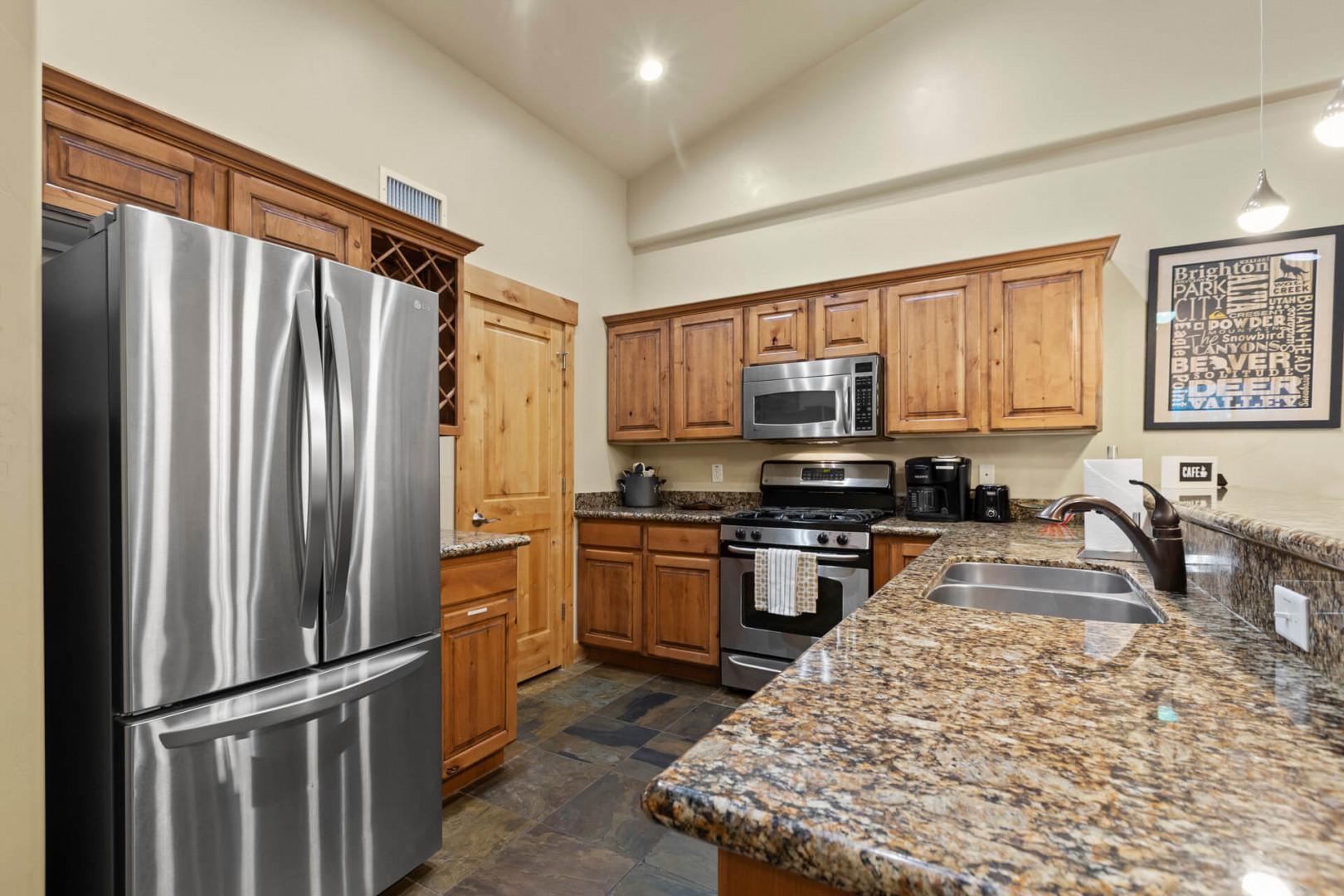 Bear Hollow 1404: Modern appliances and ample storage in sleek kitchen design.