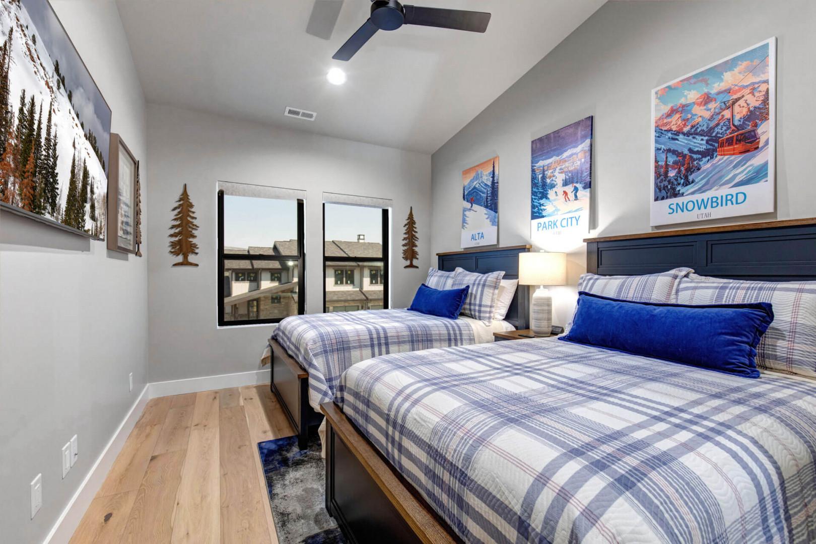 Unwind in your cozy ski-themed bedroom with two plush beds and mountain charm—perfect for restful evenings after your adventures.