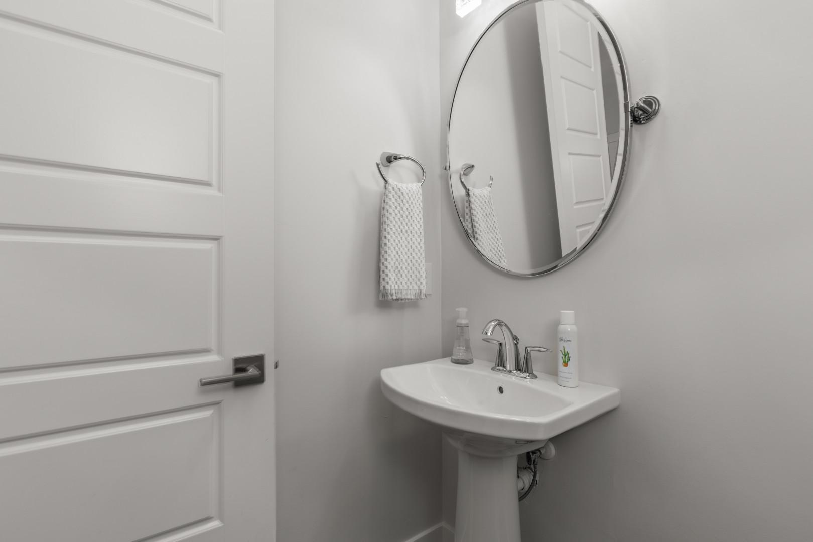 Deer Springs 12797: Reflective sink area with a sleek mirror, perfect for morning routines.