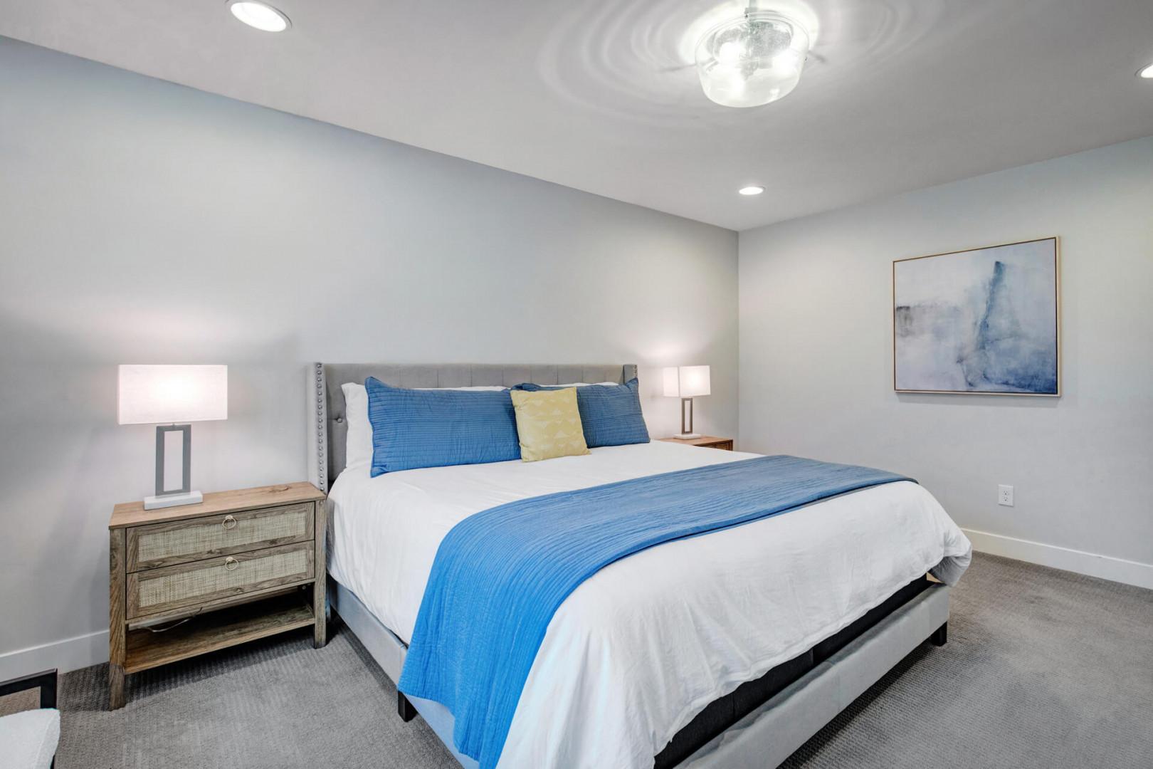 Unwind in your tranquil bedroom with crisp linens and calming coastal tones that invite deep, restful sleep after your day of adventure.