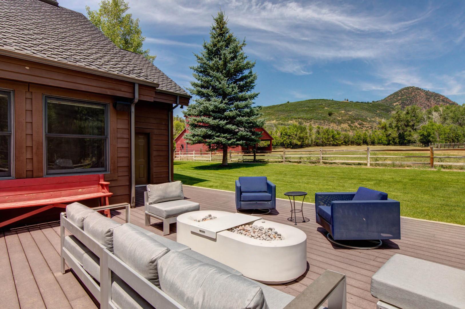 Outdoor Patio: "Cozy sofa set around a glowing firepit under the stars."