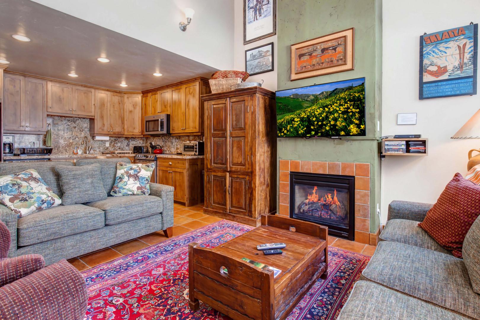 Cozy sofa set by the gas fireplace, overlooking the window and TV.