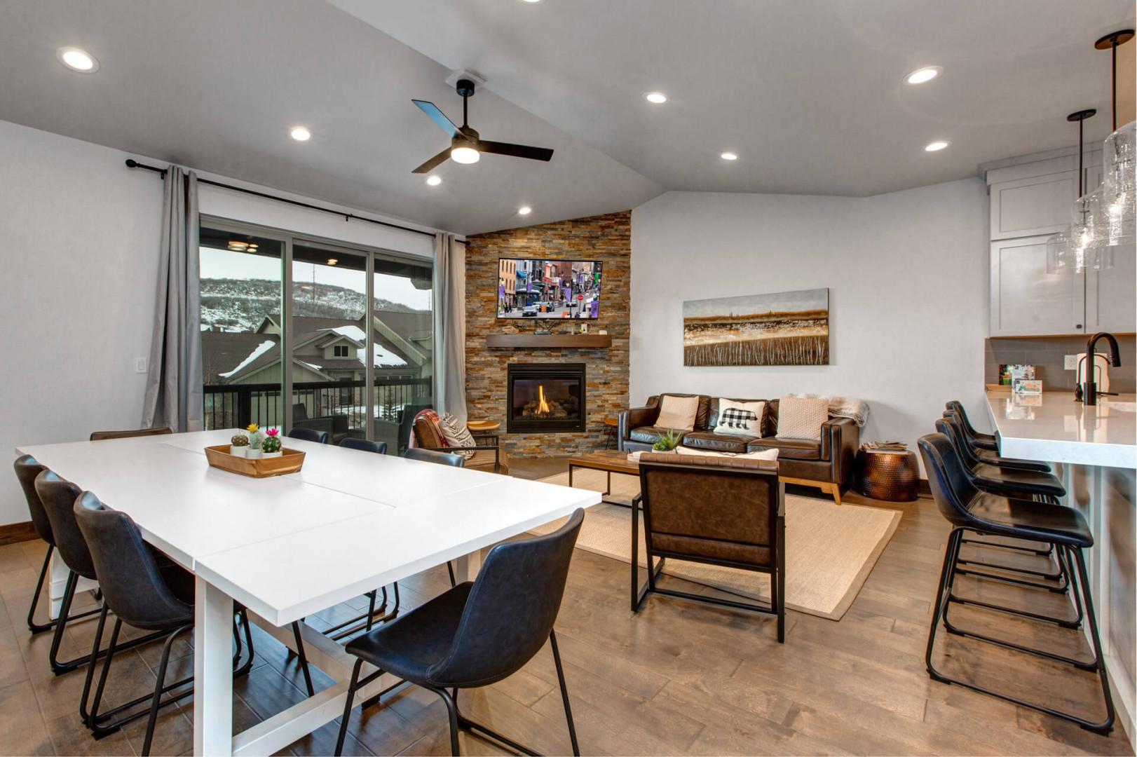 Black Rock Ridge 14494: "Cozy setup with dining table, sofa set, and a crackling fireplace."