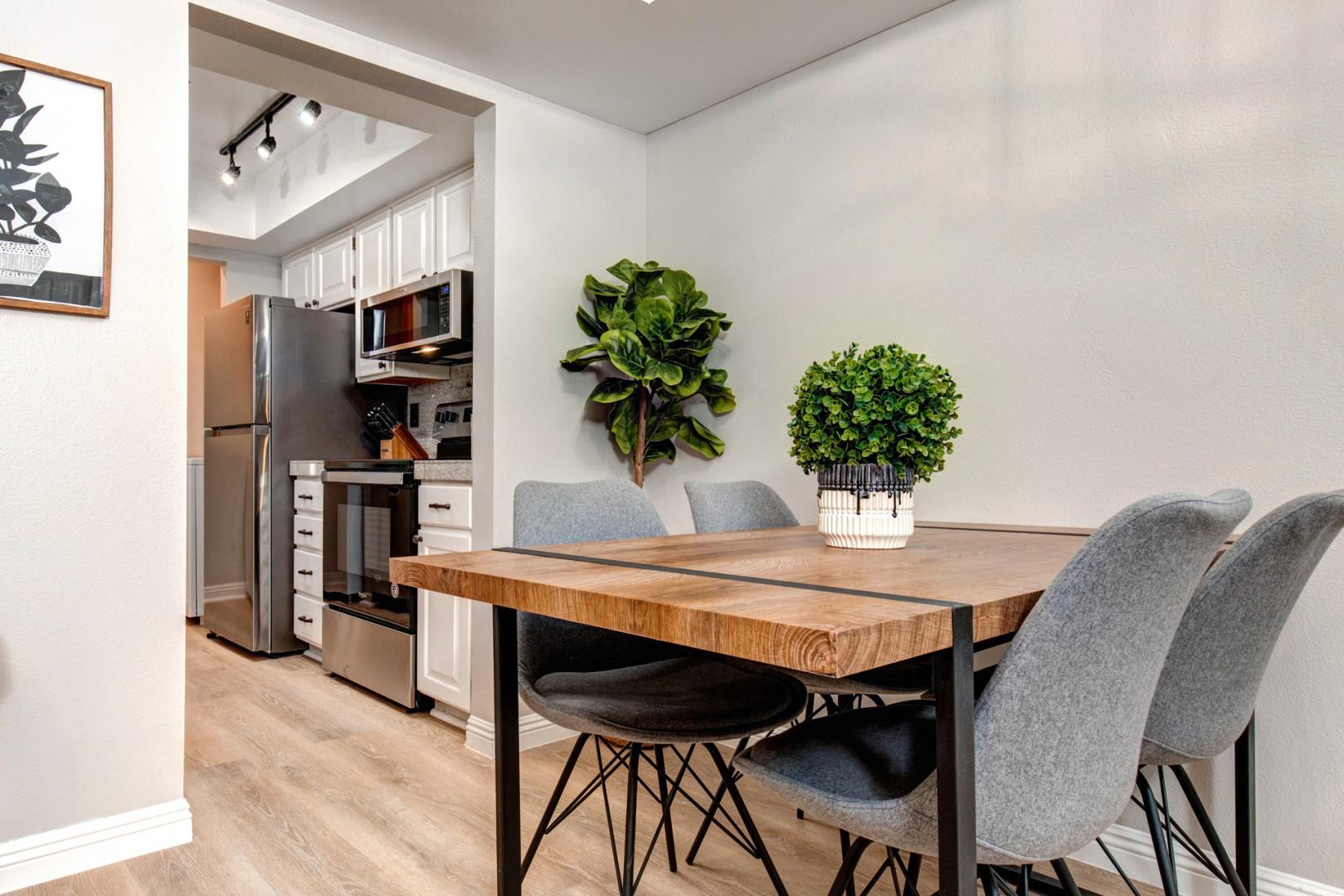 Powderwood 7B: Inviting dining table in a cozy kitchen setting.