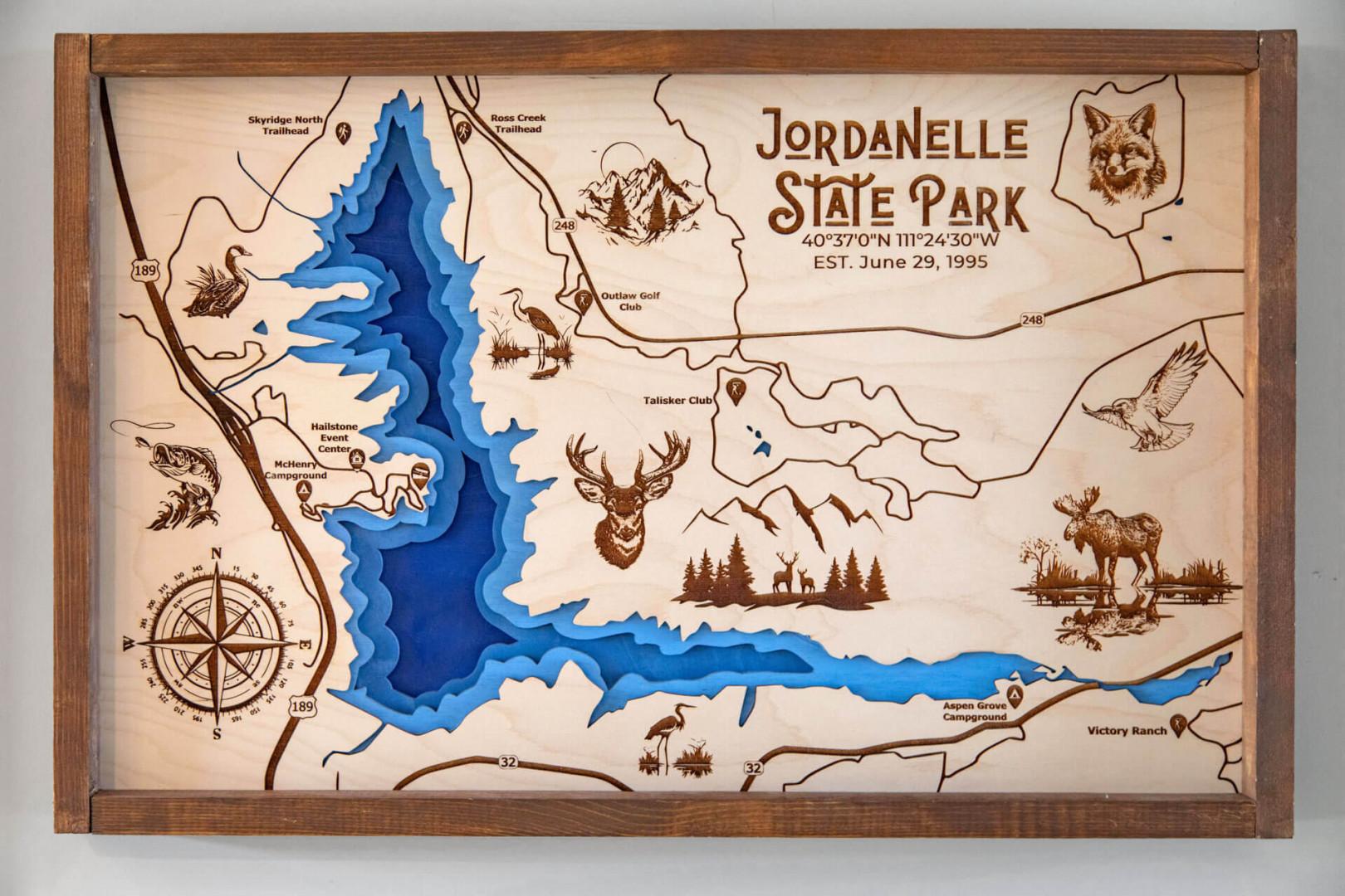 A beautifully crafted wooden map of Jordanelle State Park showcasing the reservoir, trails, and local wildlife—perfect for exploring the area's outdoor adventures.