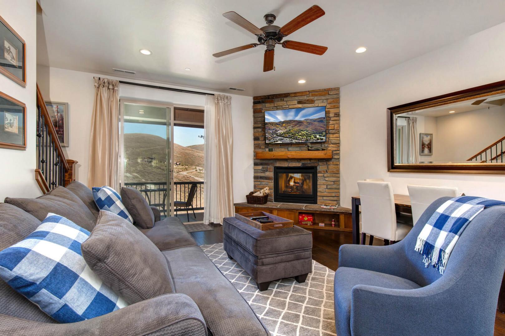 Parks Edge 13322: Living Room: "Cozy setup with a fireplace and a view to the patio."