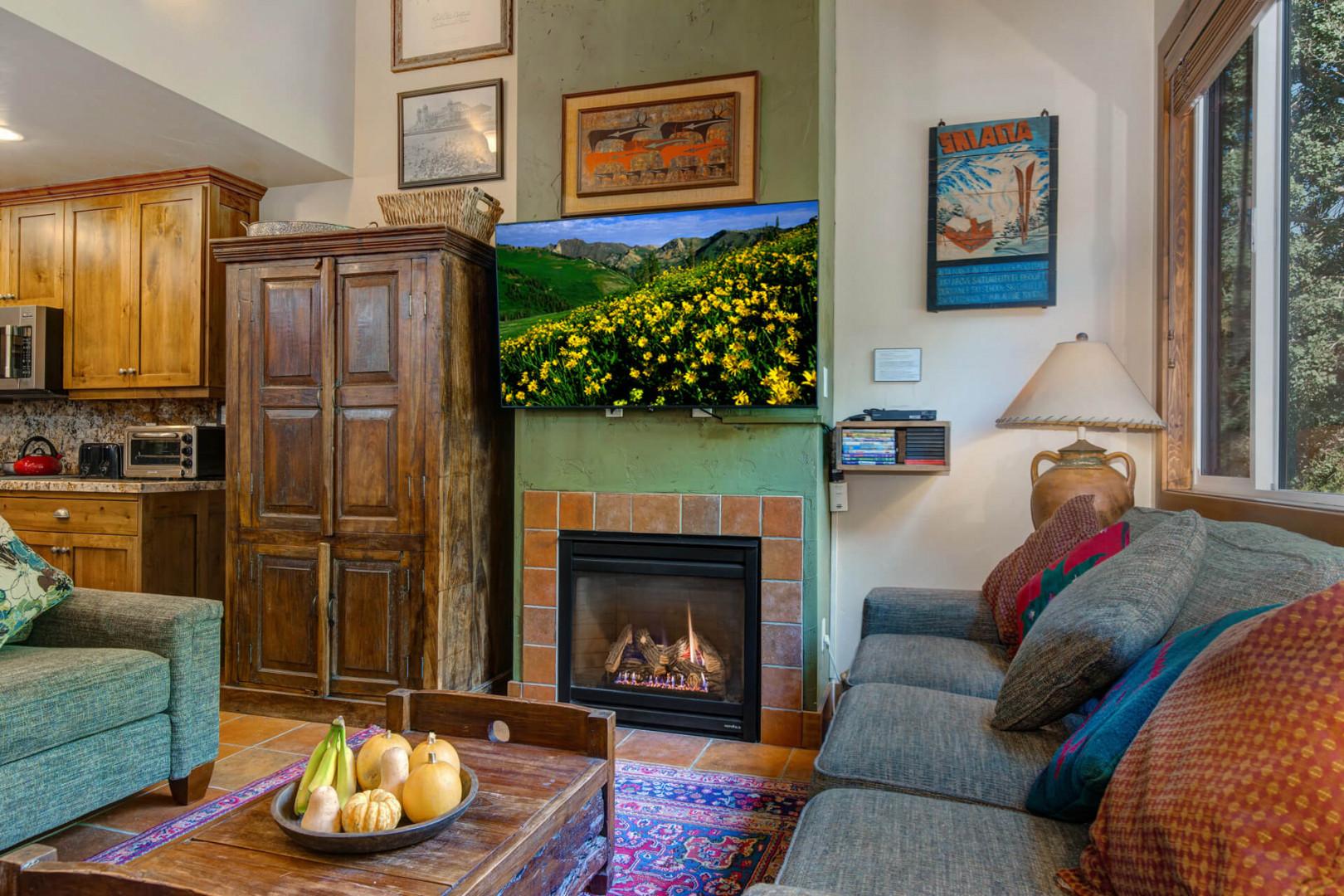 Cozy sofa set by the gas fireplace, overlooking the window and TV.