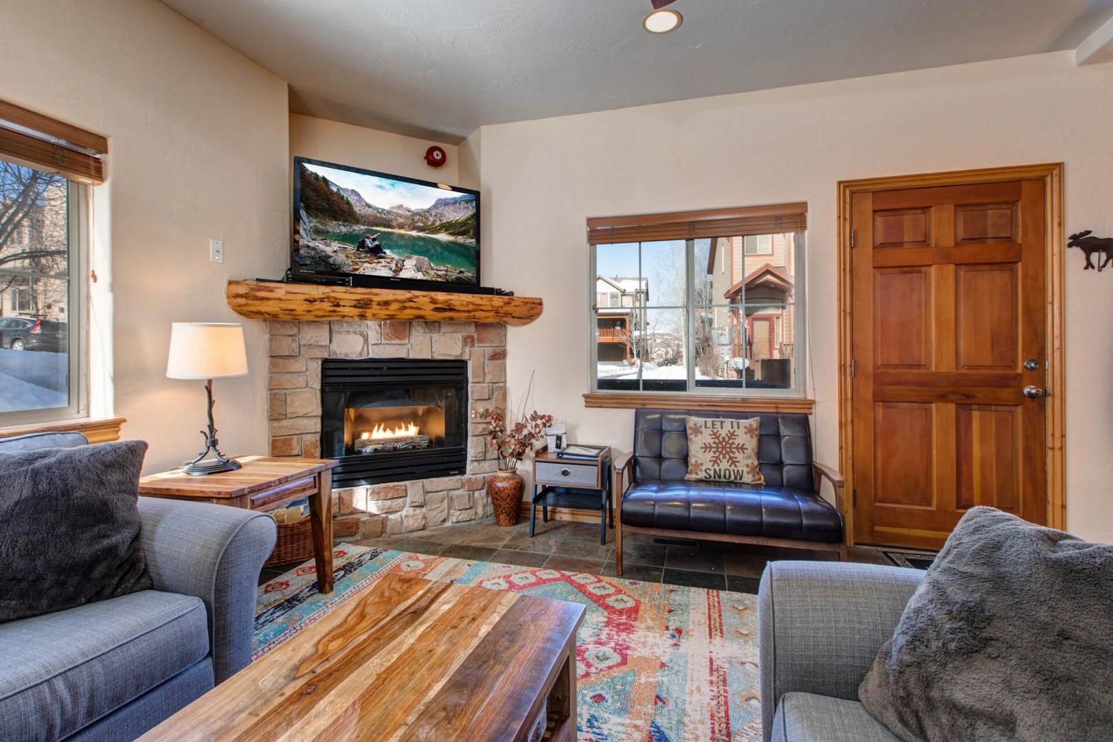 Bear Hollow Lodges 5474: Cozy setup with a stylish sofa, center table, and inviting fireplace.