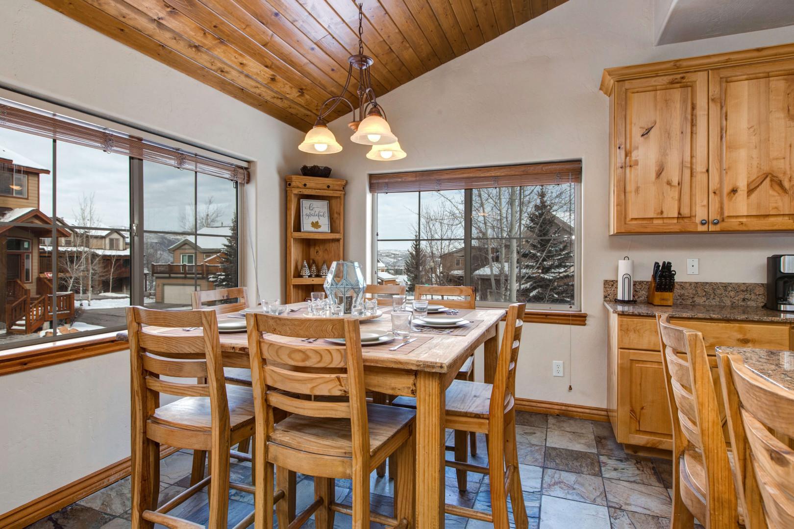 Bear Hollow 5478:  Sunlight streams through windows, illuminating the cozy dining table