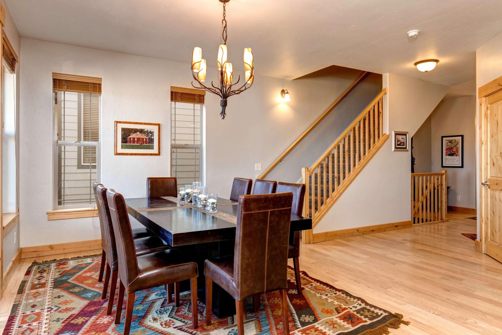 Bear Hollow Village 5639: Inviting dining table by elegant staircase, perfect for family gatherings.