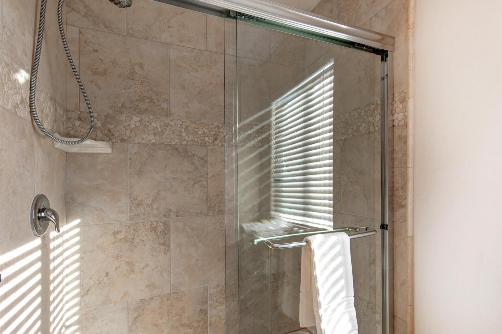 Modern shower with glass enclosure, a sleek and stylish design.