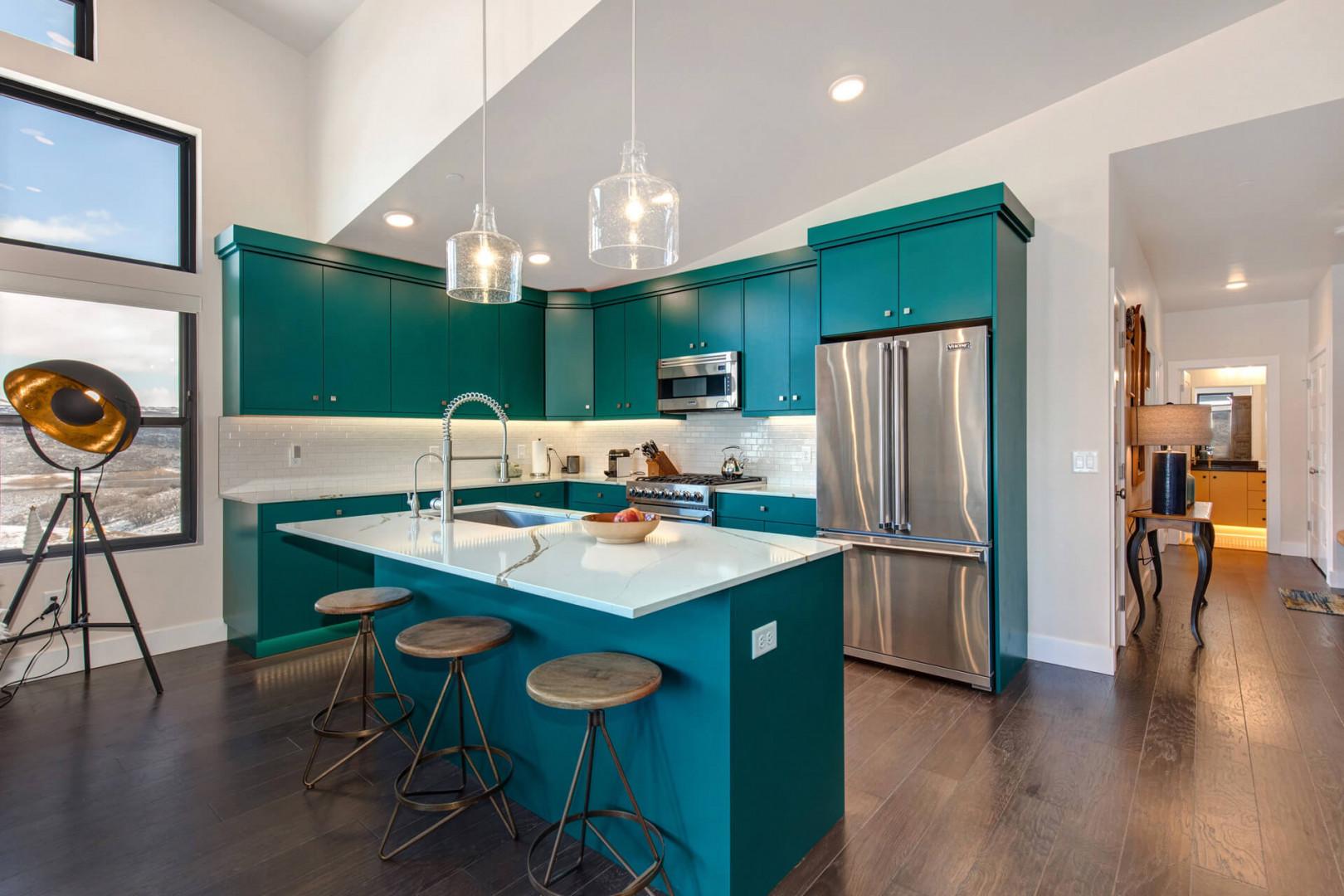 Cozy bar stools by the kitchen bar table, perfect for breakfast.