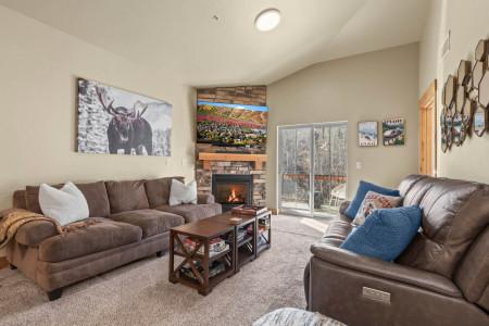 Vacation Rentals in Park City at Bear Hollow Lodges 1404: Living room with gas fireplace and private balcony access