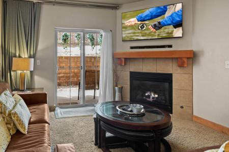 Vacation Rentals in Park City at Bear Hollow Lodges 4205: Living room with gas fireplace and patio access