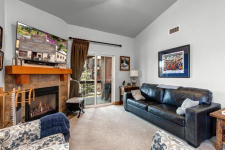 Vacation Rentals in Park City at Bear Hollow Lodges 4403: Living room with gas fireplace and private balcony access