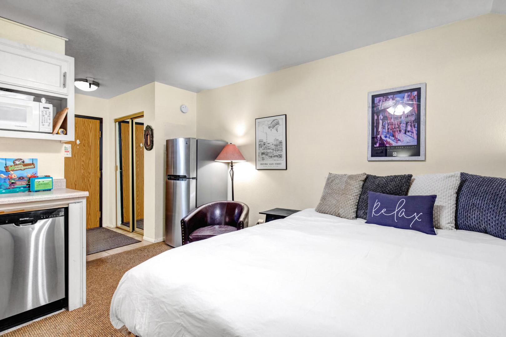 Settle into your cozy retreat with a plush bed, compact kitchenette, and modern appliances at your fingertips—everything you need for a restful, easy stay.