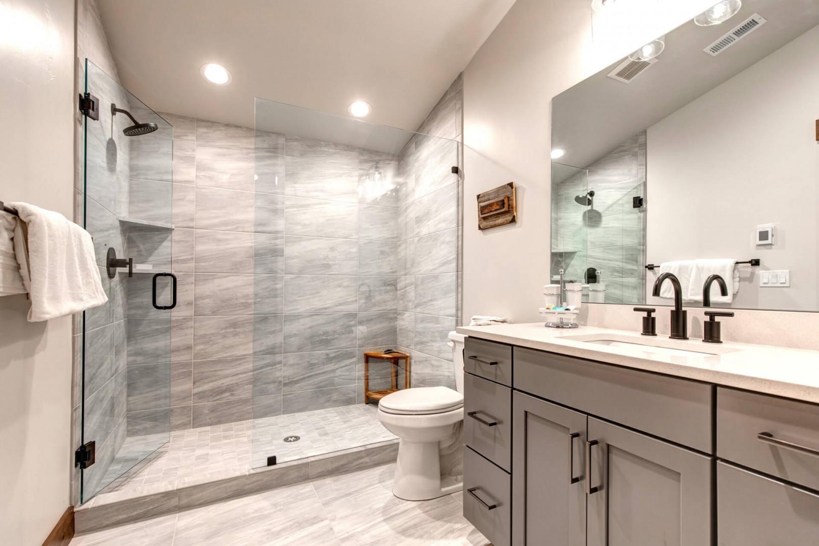 Black Rock Ridge 14457: Sleek sink, mirror, toilet, and shower in modern design.