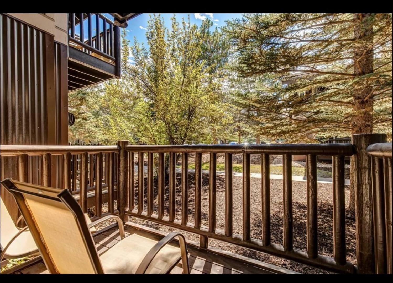 Step onto your private balcony and sink into comfortable seating while soaking up peaceful garden views surrounded by mature trees.