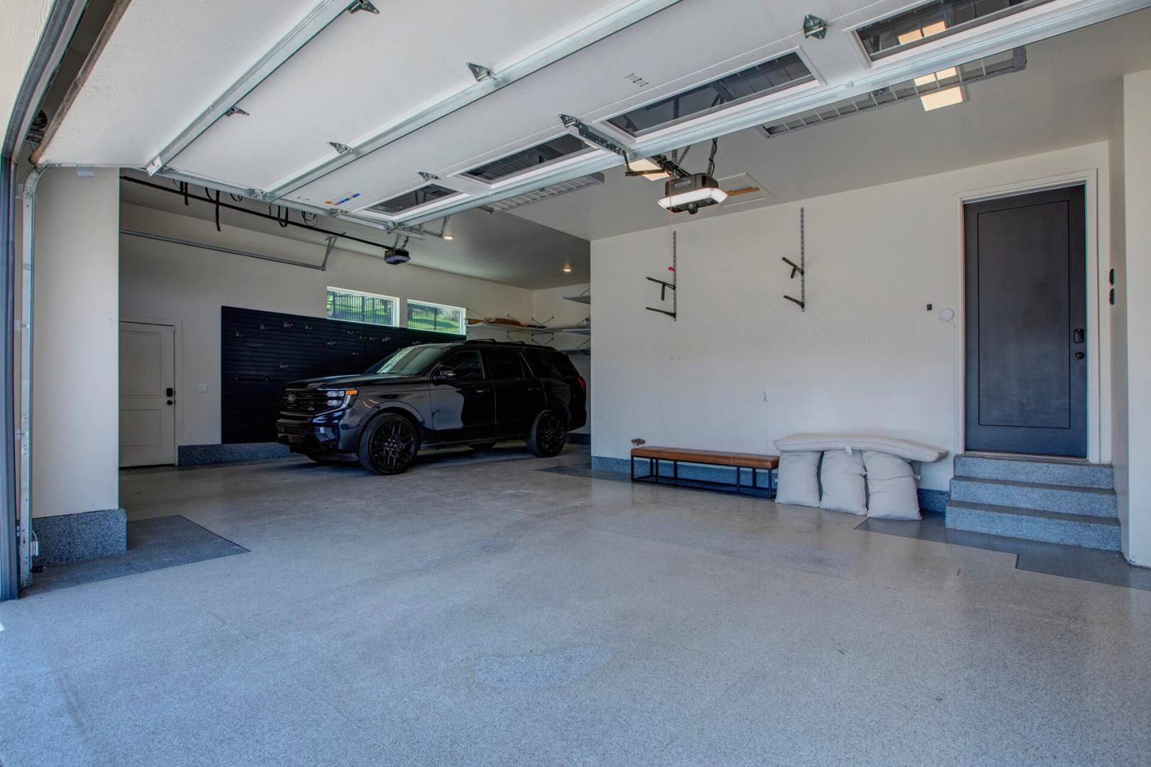 Spacious garage with convenient parking and easy access to the property, featuring clean floors and organized storage options for your gear.
