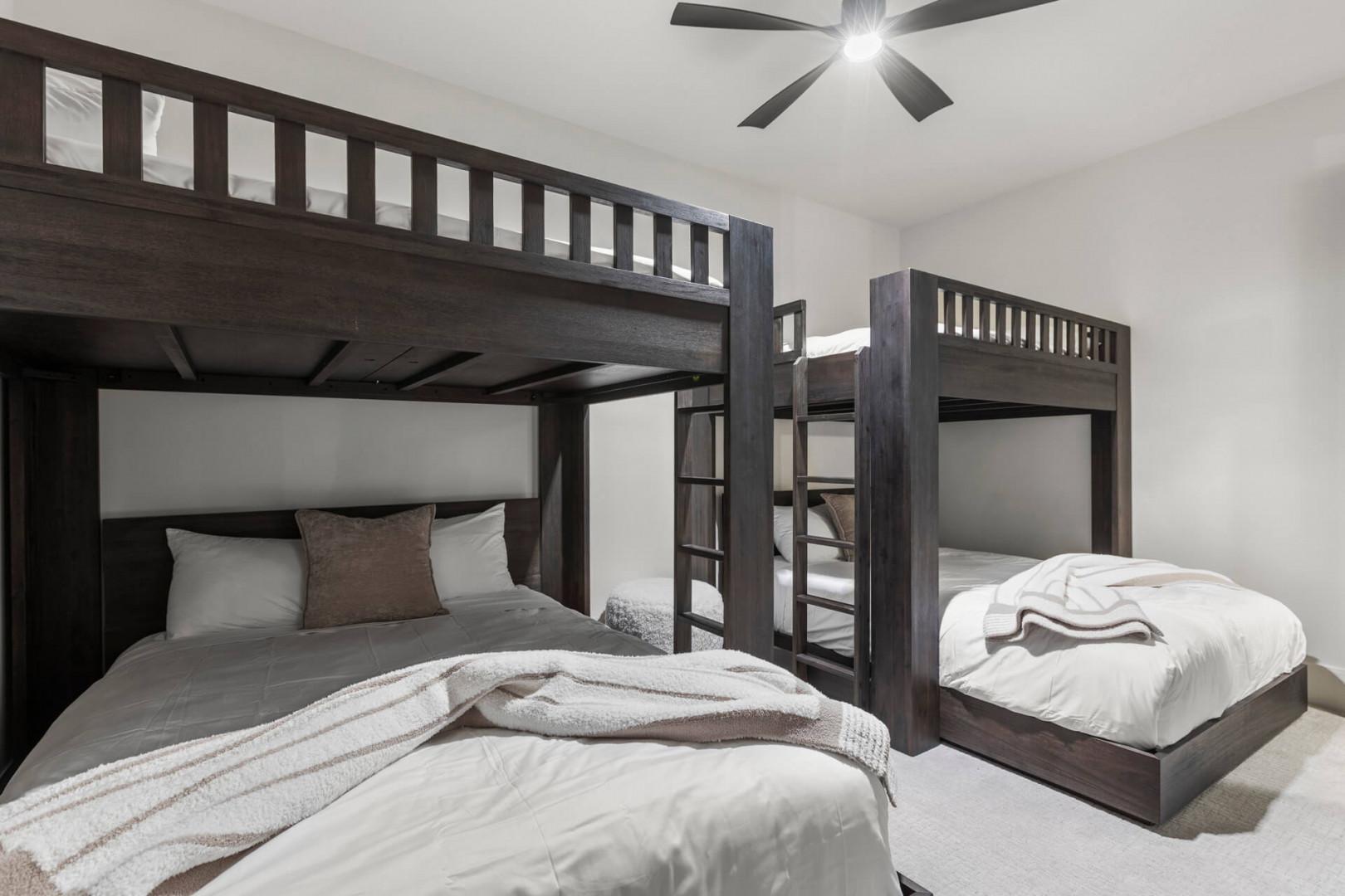 Gather your crew in this spacious bunk room where everyone can rest together. Thoughtful touches like plush throws and accent pillows make each bed your personal retreat.