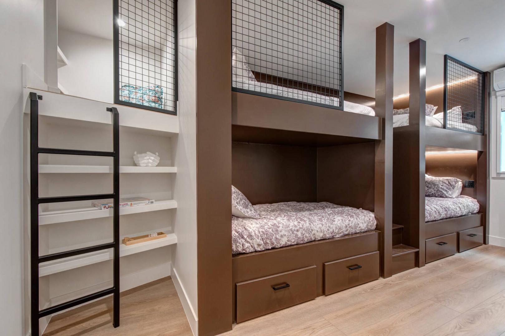 Upper Main 301: Sleep soundly in your custom bunk bed with built-in storage and privacy screens, perfect for families or groups.