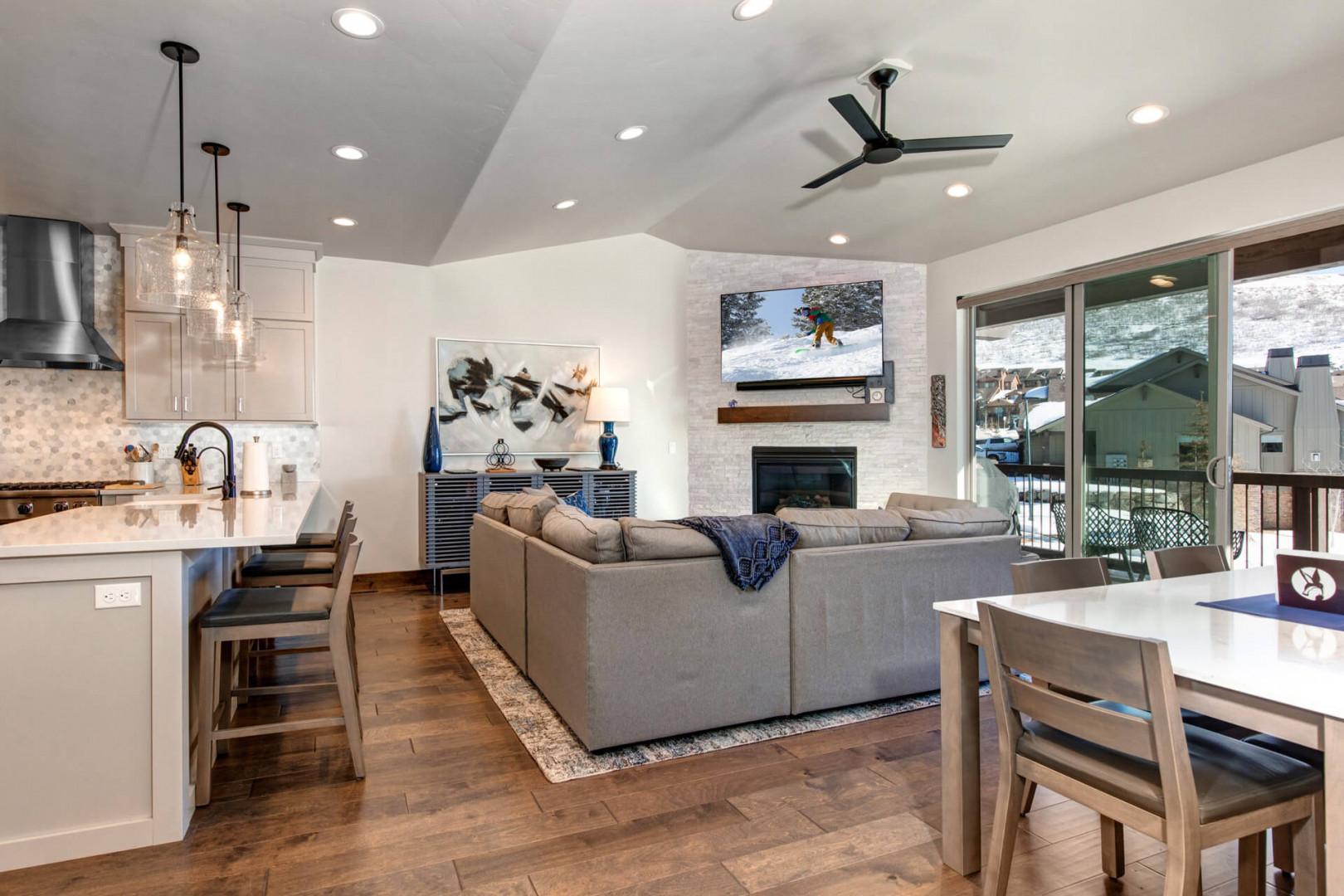 Black Rock Ridge 14457: Living Room: Cozy setting with a fireplace, patio access, and stylish bar stools.