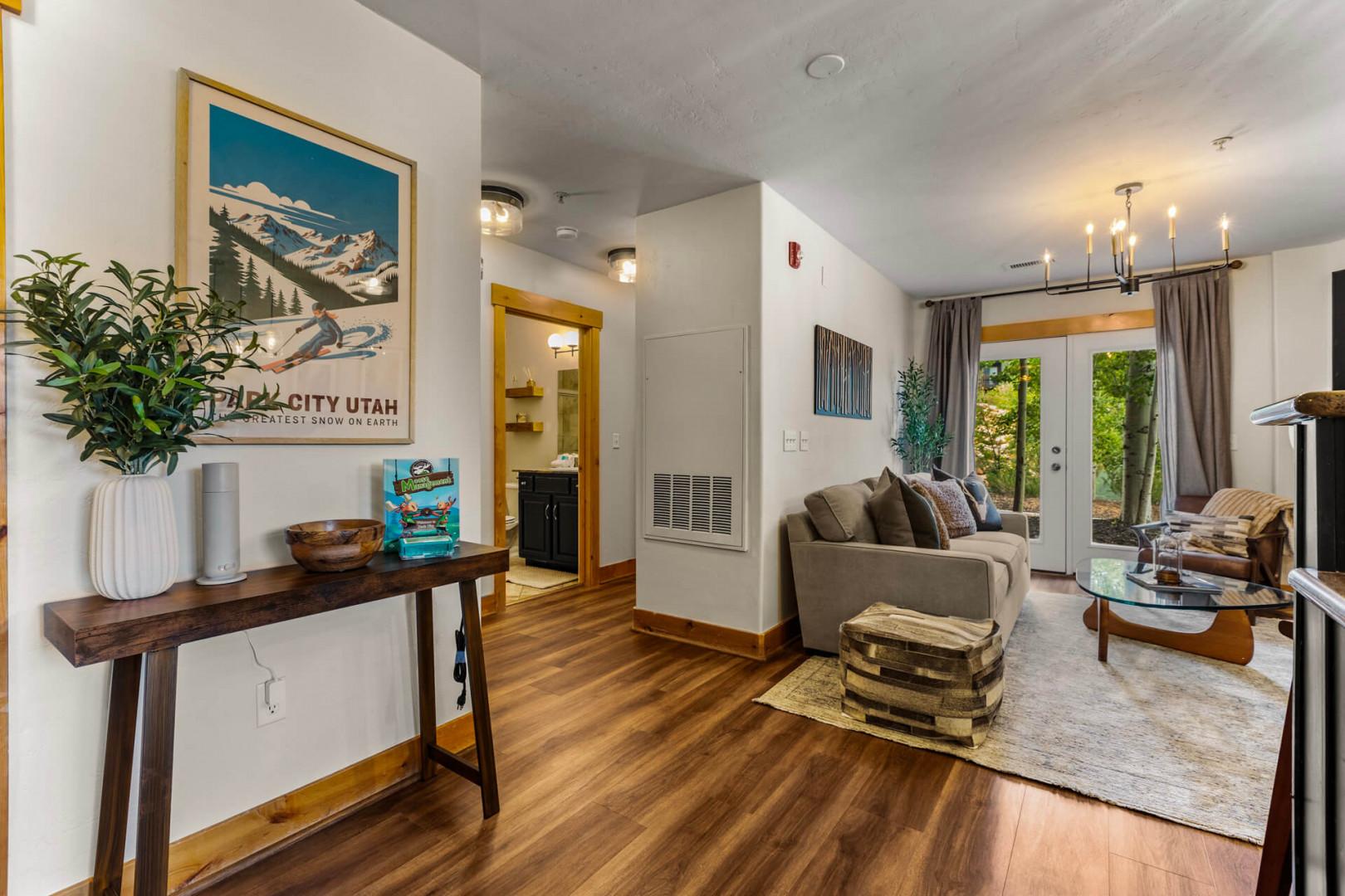 Bright, welcoming living space with mountain-inspired touches and warm wood floors invites you to relax and feel right at home during your stay.