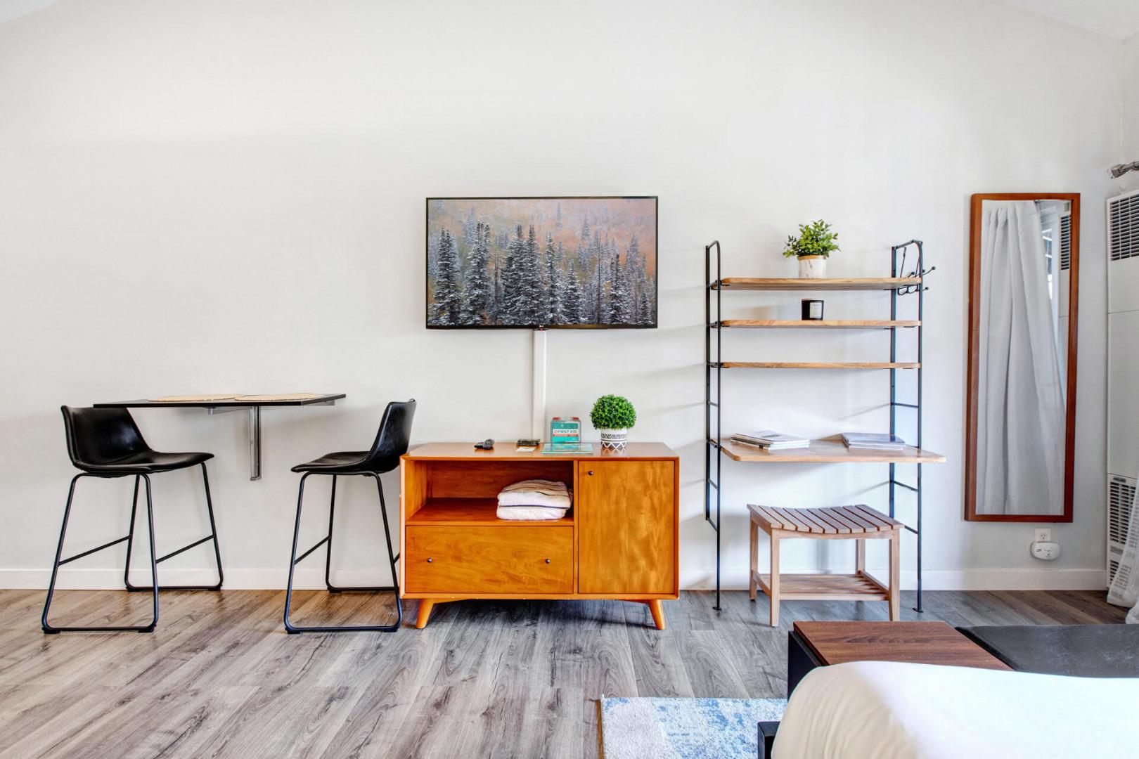 Relax in your stylishly furnished space featuring modern amenities, a convenient workspace, and thoughtful storage solutions for a comfortable stay.