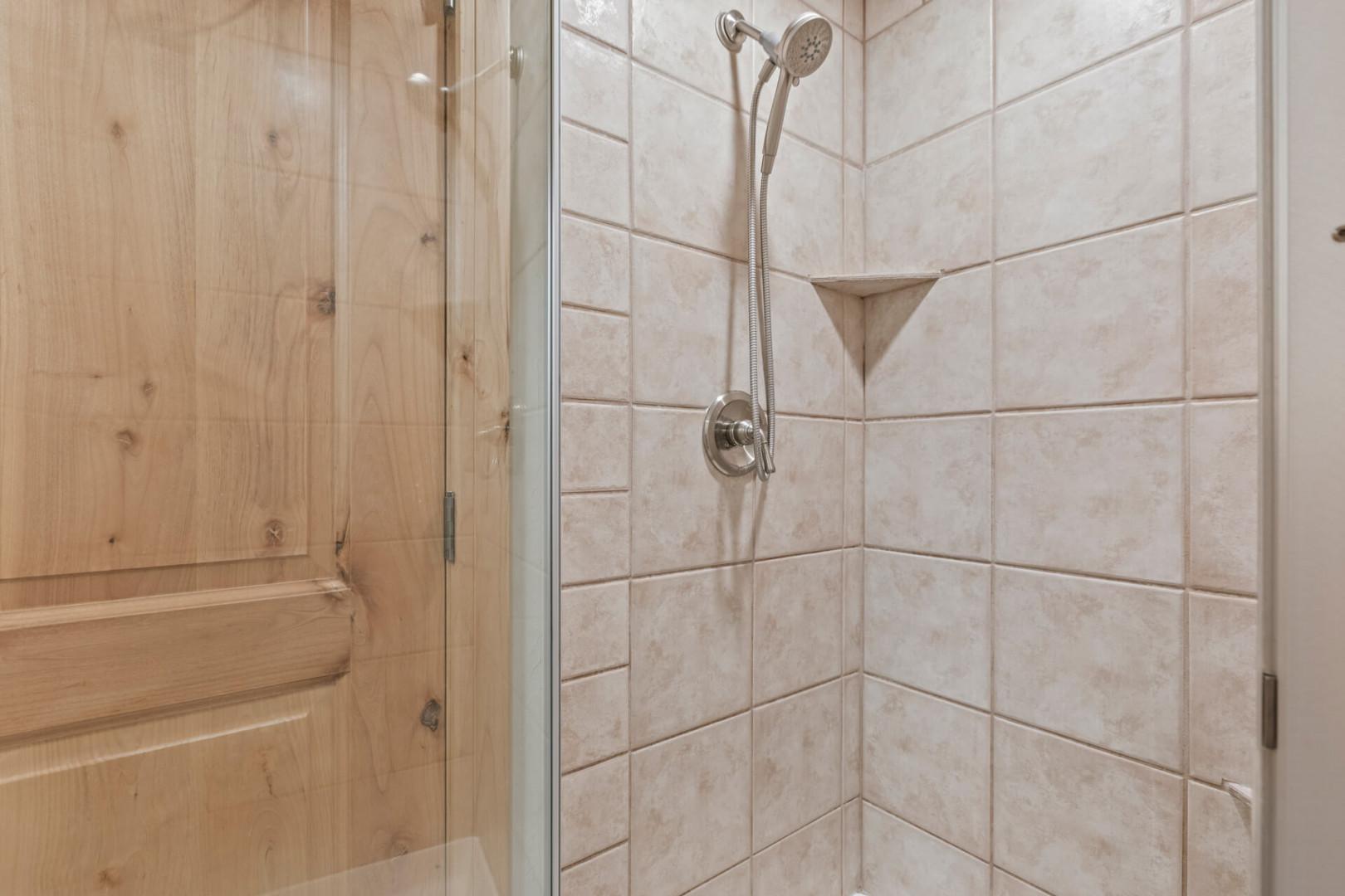 Foxpoint 1678 C by Moose Management: Primary en suite bathroom walk in shower