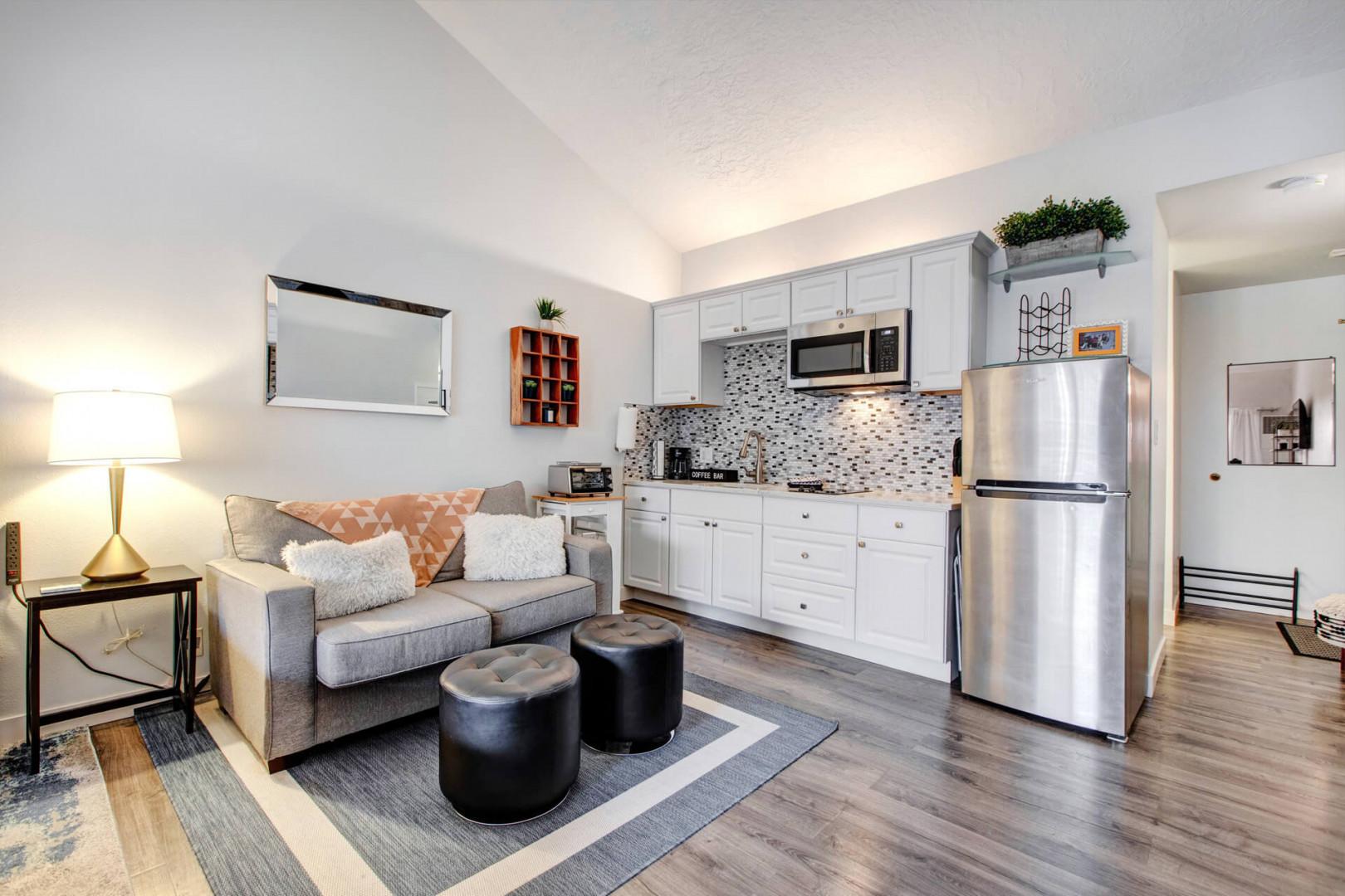 Step into your stylish open-plan retreat where modern comfort meets convenience. Cook, relax, and unwind in this thoughtfully designed space.