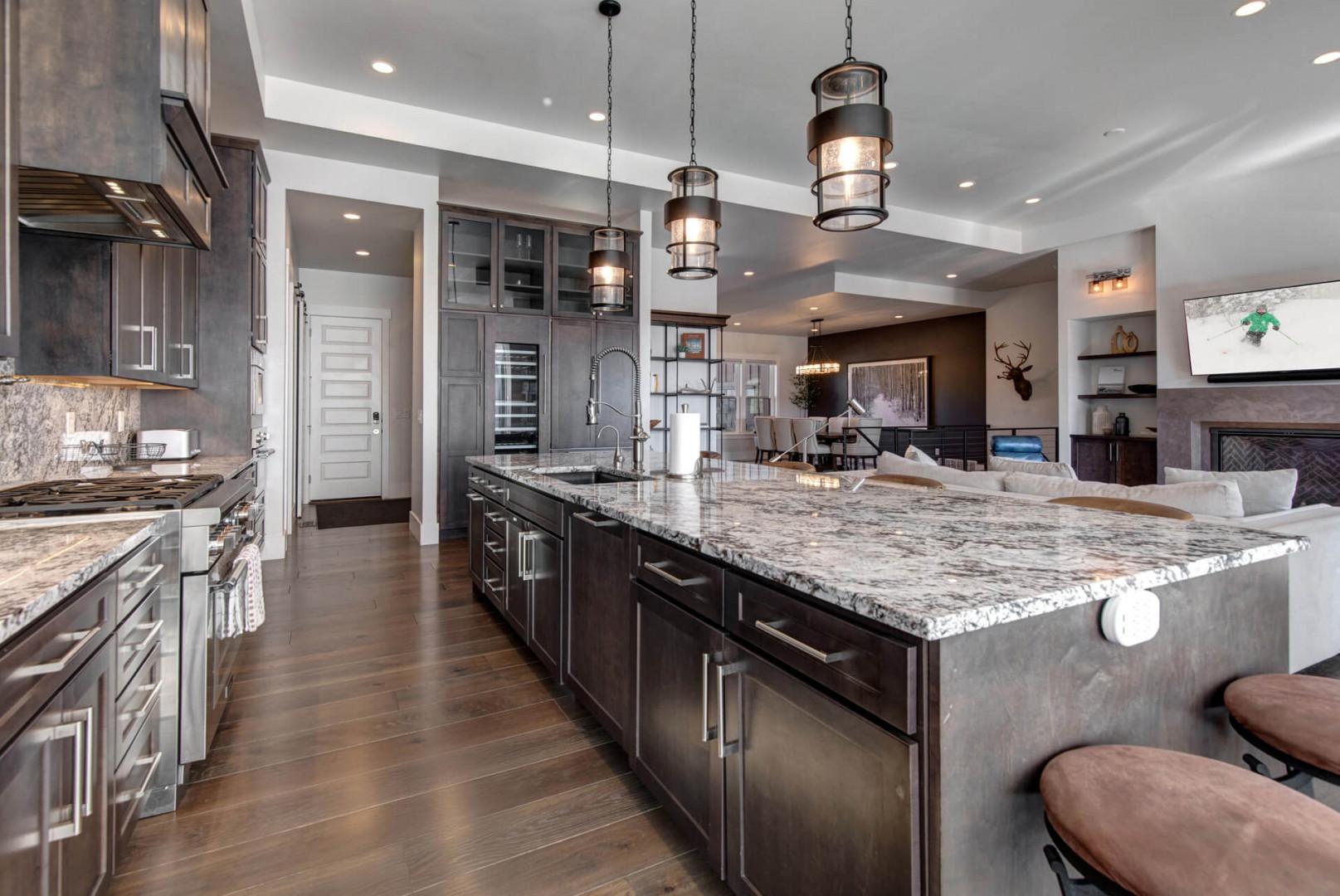 Deer Springs 12797: The fully equipped kitchen features gorgeous, double-stacked, dark wood cabinets and quartz countertops.
