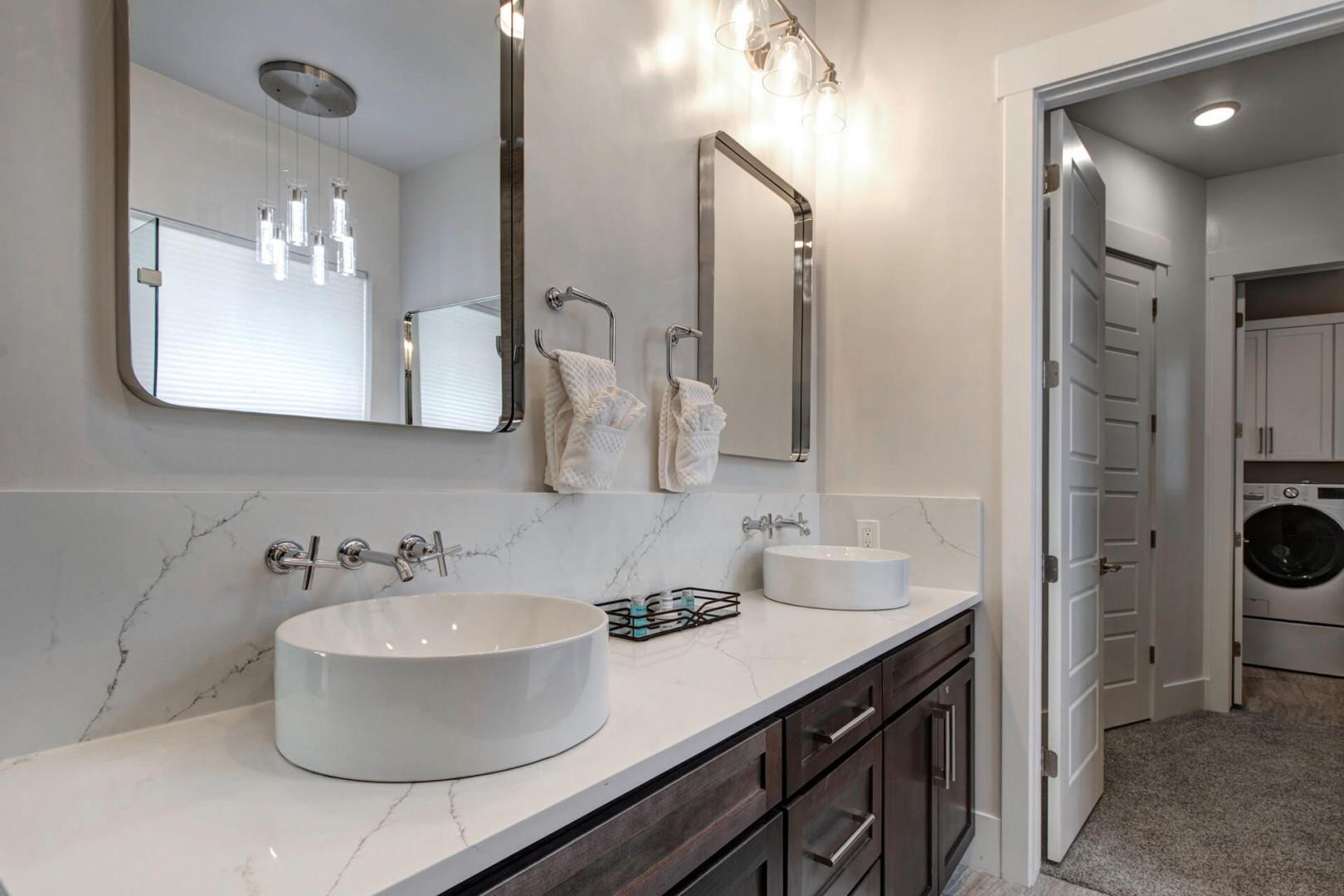 Deer Springs 12797: The primary ensuite bathroom features a double vanity with convenient storage and extra counter space.