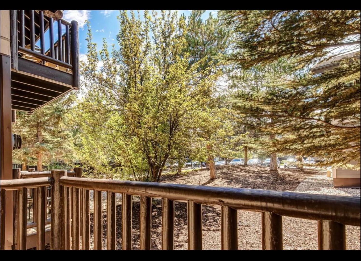 Your private balcony overlooks peaceful trees and natural surroundings, perfect for morning coffee or evening relaxation.