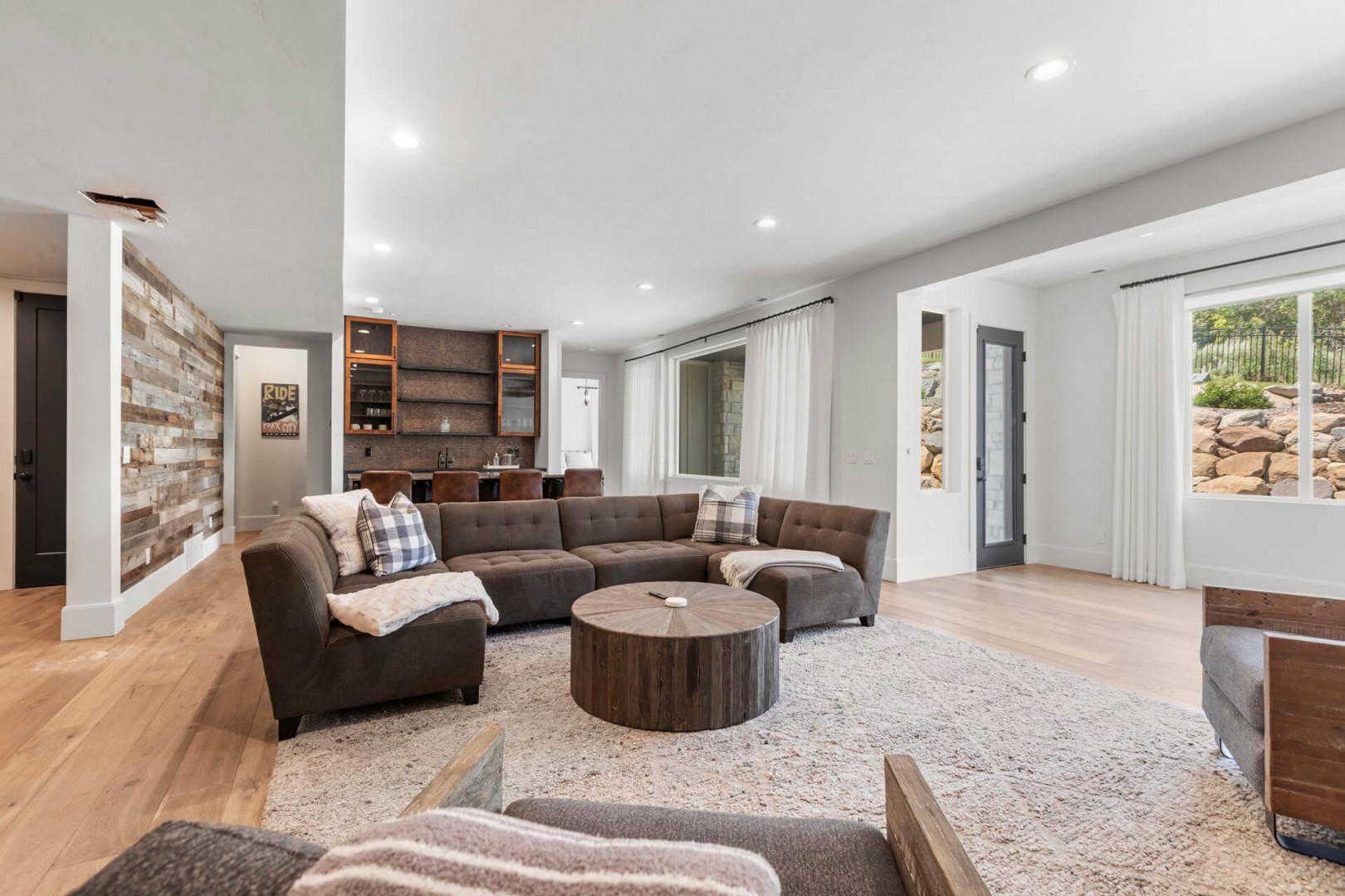 Settle into this beautifully appointed living room where natural light and modern mountain charm create your perfect retreat for relaxing evenings.
