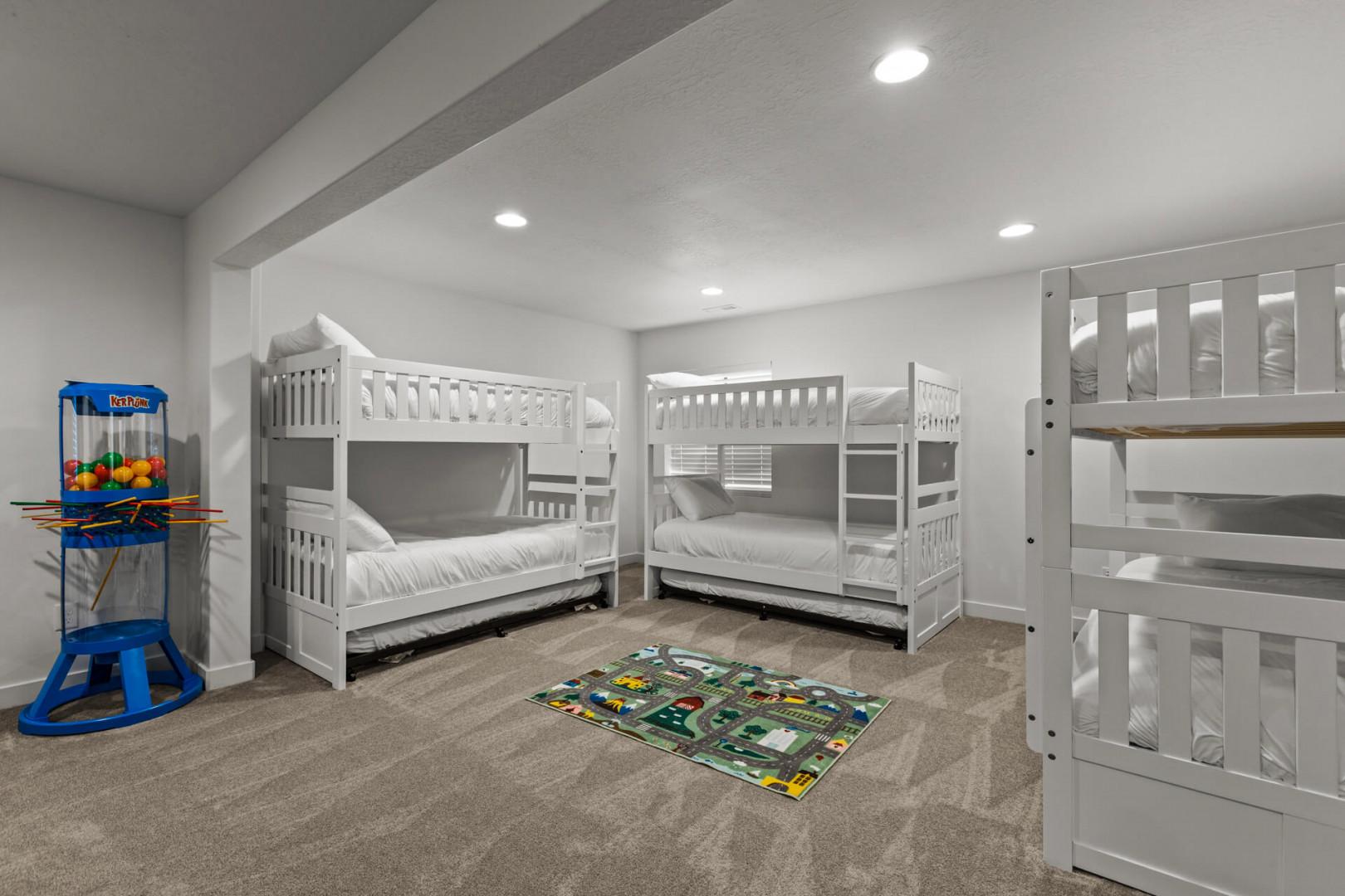 Your kids will love this fun bunk room with cozy beds, games, and plenty of space to play together.