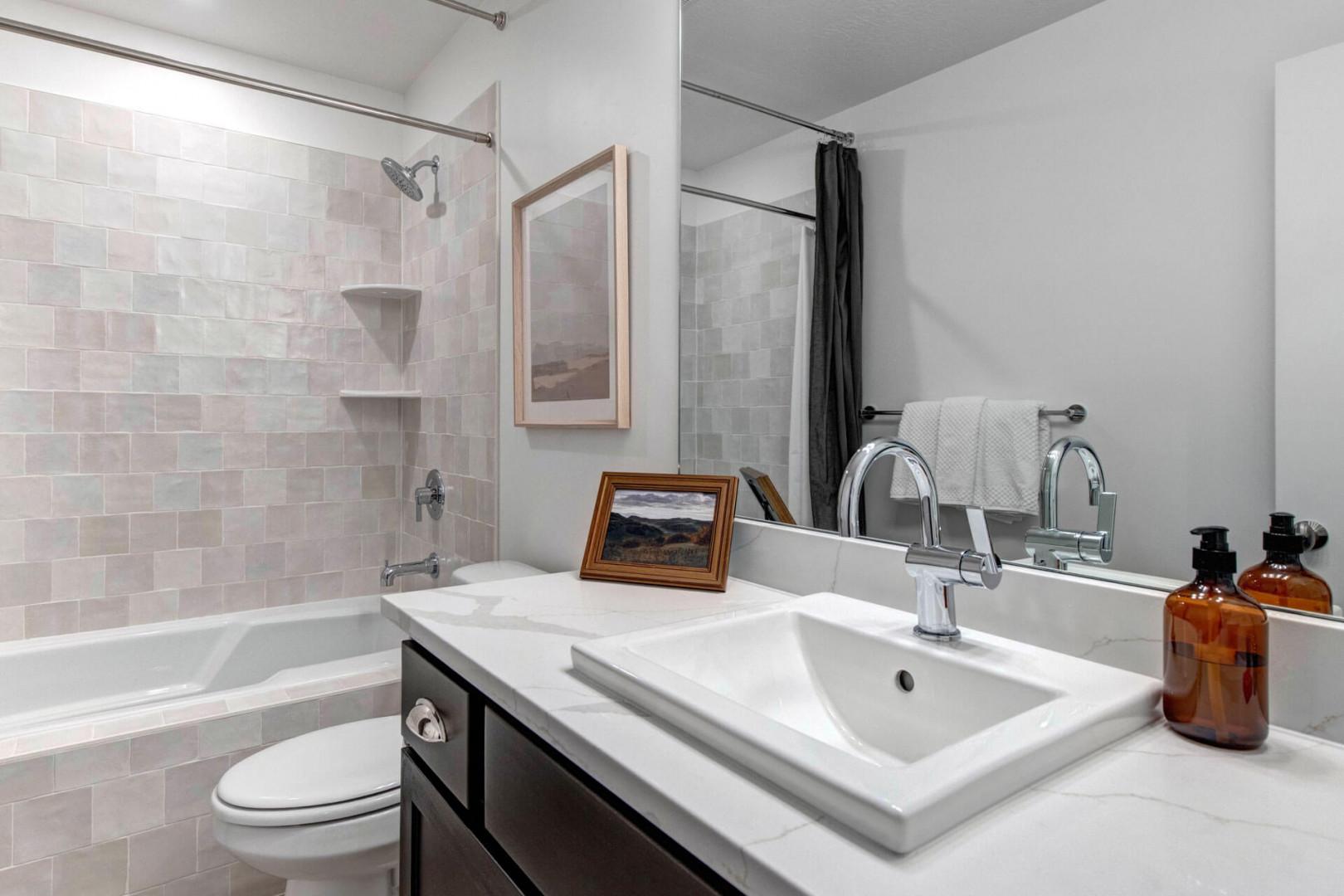 Unwind in your spa-like bathroom with a deep soaking tub, rainfall shower, and premium amenities.