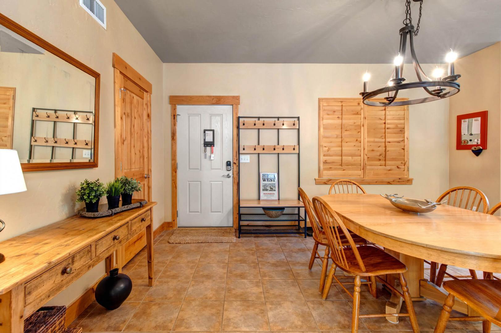 Gather around the handcrafted wooden dining table where your group can share meals and plan adventures. The spacious layout and warm wood tones create a welcoming spot for connection.