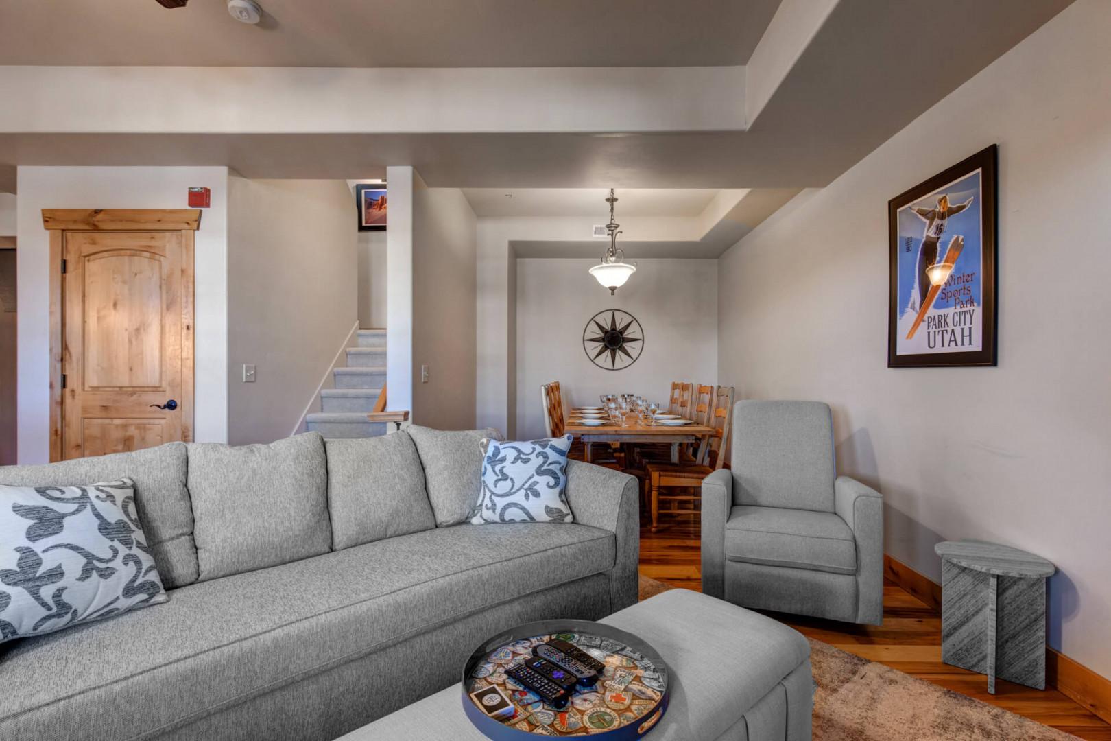 Unwind in your cozy living space with plush gray seating and warm wood accents that create the perfect retreat after your mountain adventures.