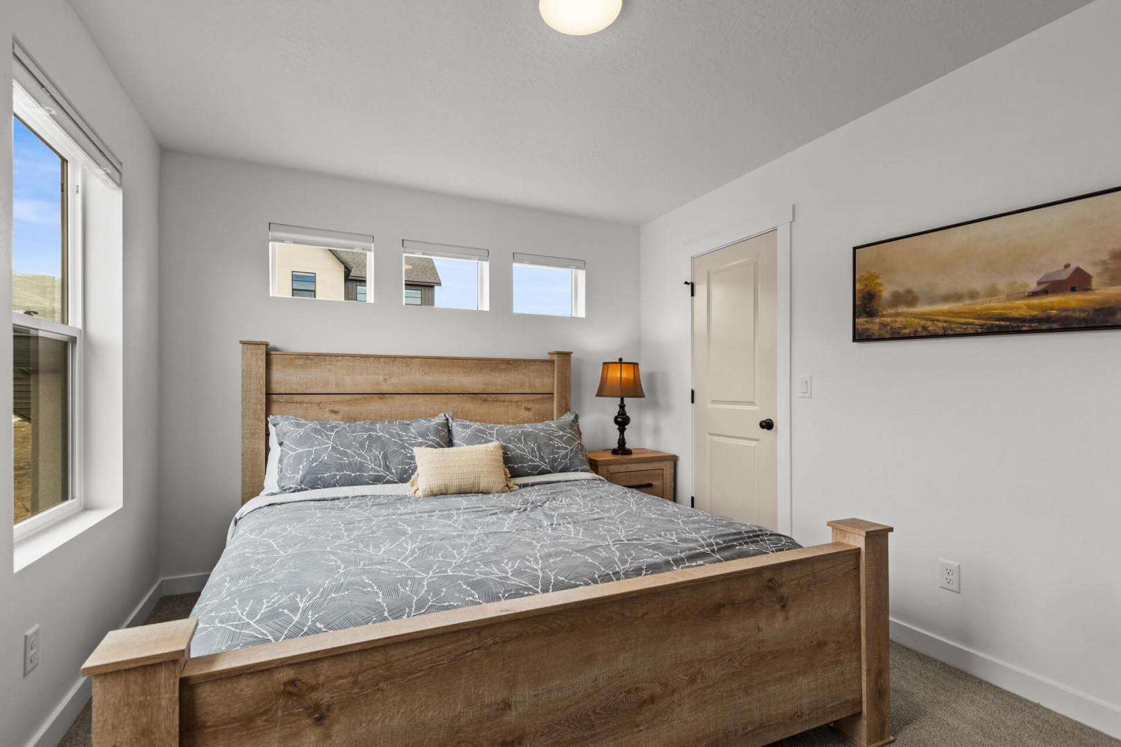 Drift off in your peaceful bedroom, where rustic wood meets modern comfort and soft natural light fills the space.